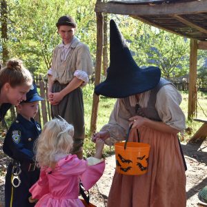 Kids trick-or-treating through historic site