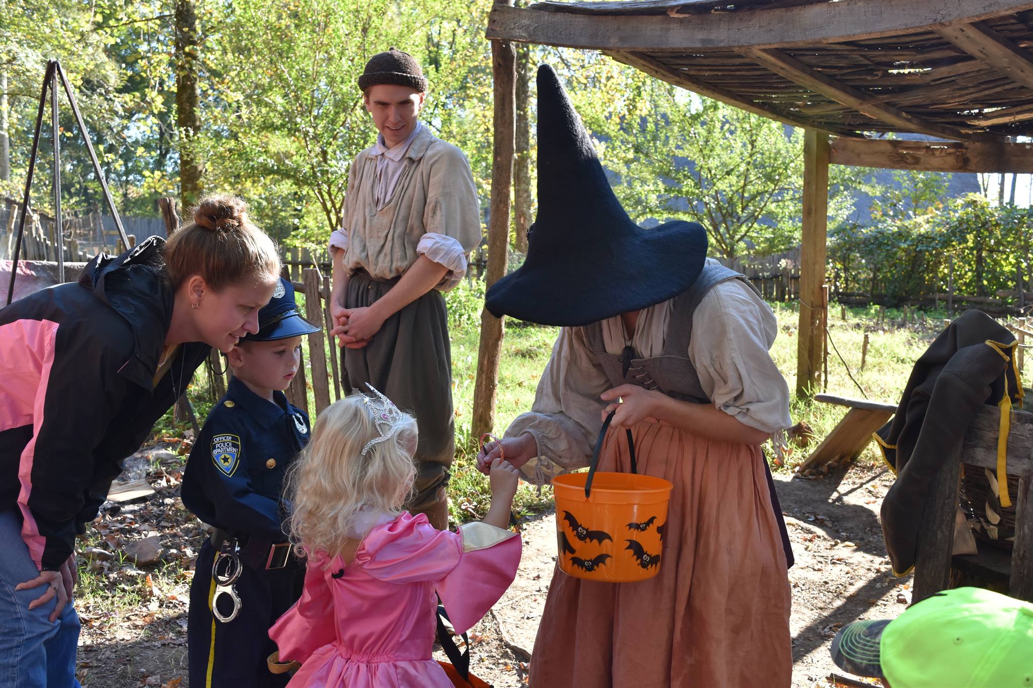 Kids trick-or-treating through historic site